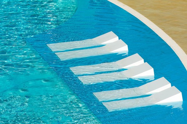 How can you incorporate eco-friendly features into your home swimming pool design?
